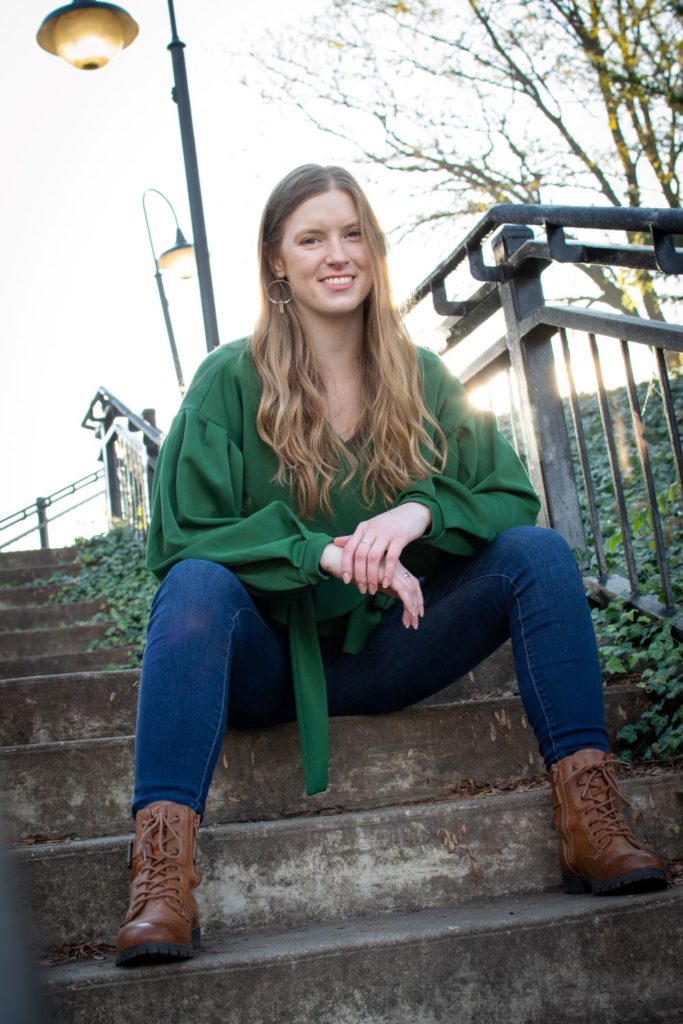 Rachel sitting on stairs ourdoors